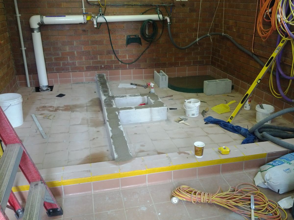 Epoxy waterproofing in progress with drainage detail