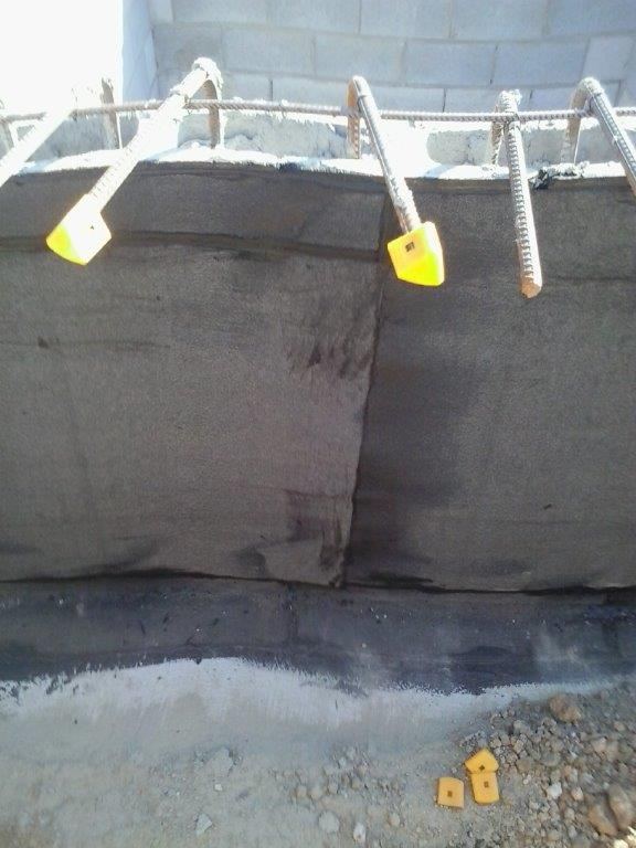 Lift pit wall with waterproofing membrane applied
